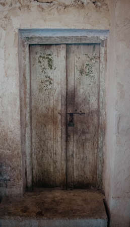 Small door made of old wood in Souq Waqif, Qatarの写真素材
