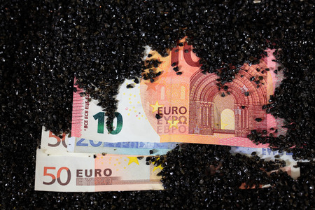 Euro Notes in sandの写真素材