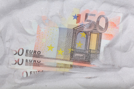 Euro Notes in sand