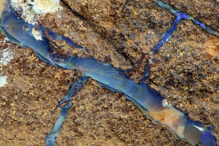 A vein of boulder opal in the host rock.