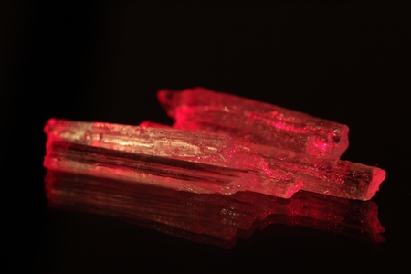 A macro photo of red glowing crystals.の素材 [FY31039299811]