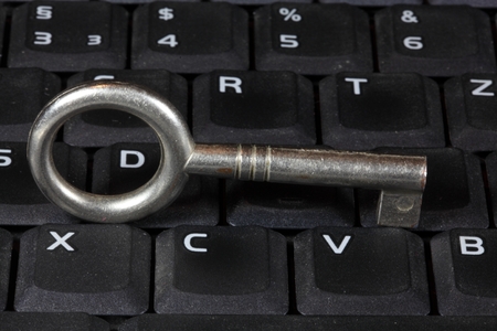 An old key on a keyboard.の写真素材