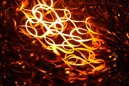 Glowing steel wool in the flame of a  blowpipe.