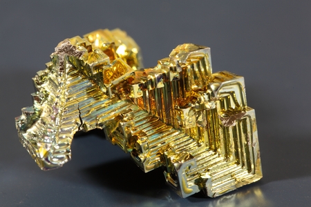 Macro photo of a crystallized piece of Bismuth metal.