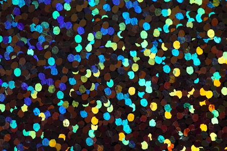 Macro photo of a glittering surface as background.