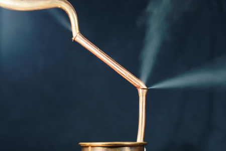 Copper pipes with a leak and steam.の写真素材