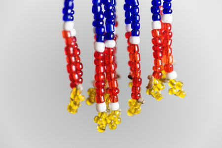 Macro photo of small beads with different colors on a string.の写真素材