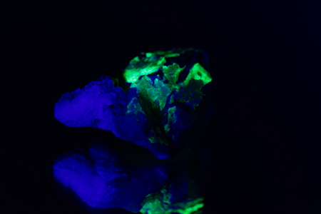 Quartz with a green fluorescent hyalite cover from Namibia.の写真素材