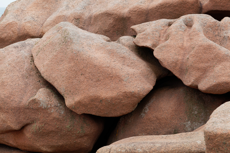 Rocks on the rose granite coast in Brittany in France.の写真素材