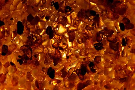 Amber grains with backlight illumination as texture or background.の写真素材