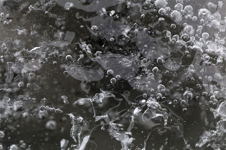 A macro photo of glacier ice with gas inclusions, from the Pasterze glacier in the Eastern Alps in...
