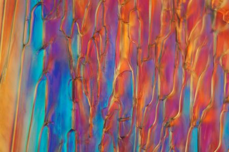 Frozen beer under a microscope and in polarized light. The photo shows ice crystals developed in beer. The form is different according to the type of beer.の写真素材