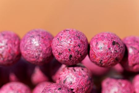 Macro photo of pink beads made of paper m?chの写真素材