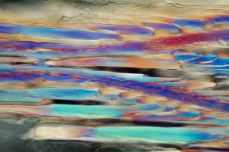 White wine under a microscope, Sauvignon blanc. The photo shows crystals of frozen wine in polarized...