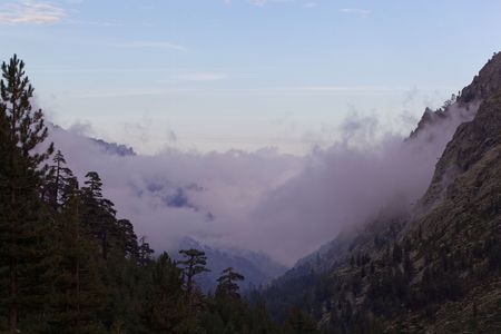 Mountains with clouds in the Restonica valley in Corsica, France