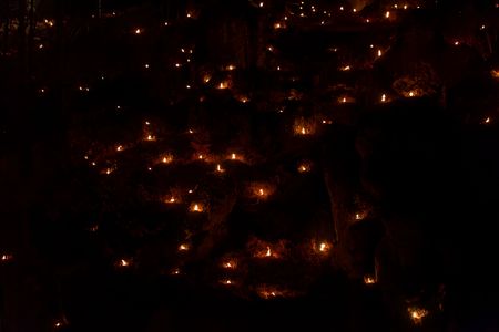 Small fires on a mountain slope during a light celebration in the Franconian Alb, Bavaria, Southern Germany.の写真素材