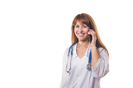 The young woman the doctor speaks by phoneの写真素材