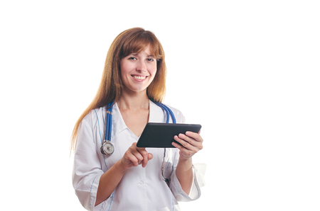The woman the doctor works with the tablet and smilesの写真素材