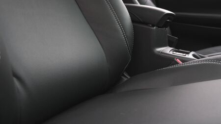 luxurious car interior with black leather seats. Black leather seat covers in the car.