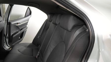 luxury leather seats in car. beautiful leather car interior design. Black leather seat covers in the car. artificial leather rear seats in the car. beautiful leather car interior design. Slow motionの写真素材