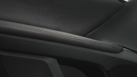beautiful leather car interior design. luxury leather seats in the car. Black leather seat covers in the car. artificial leather rear seats in the car.の写真素材