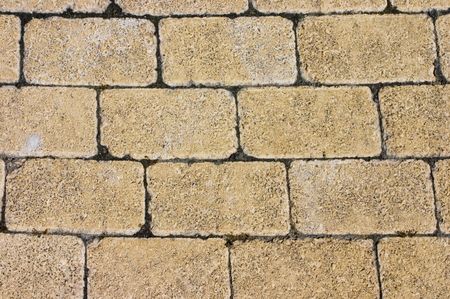 Pale yellow bricks in a road floor. The image have a little perspective.の写真素材