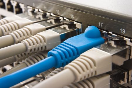 Switch plugged with some RJ45 connectors and copper cables