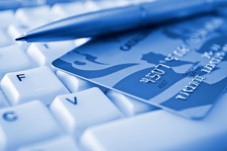 Credit card over a keyboardの写真素材