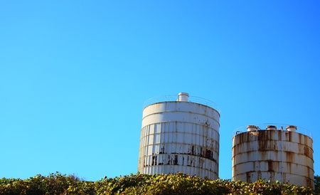 Under the blue sky of cement tankの写真素材