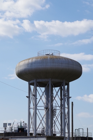 Water tank under the blue sky of Tower buildingsの写真素材