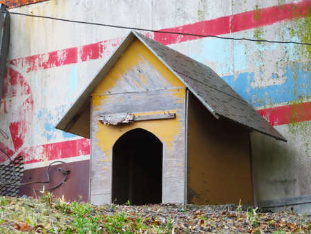 A seasoned kennel placed outdoorsの写真素材
