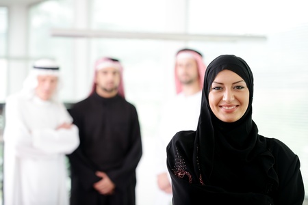 Arabic business woman working in team with her colleagues at officeの写真素材