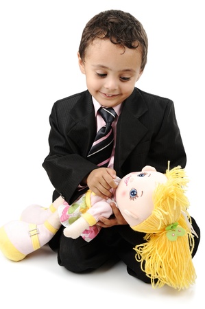 6-7 years old child sitting with a toy on the floorの写真素材
