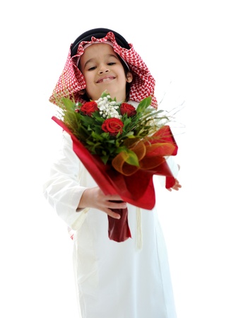 Arabic Muslim kid with bouquet of flowersの写真素材