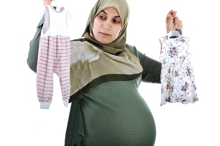 Thinking Pregnant  muslim woman ,what is it,girl or boy.の写真素材