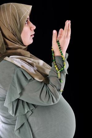 portrait of pregnant muslim woman,prayerの写真素材