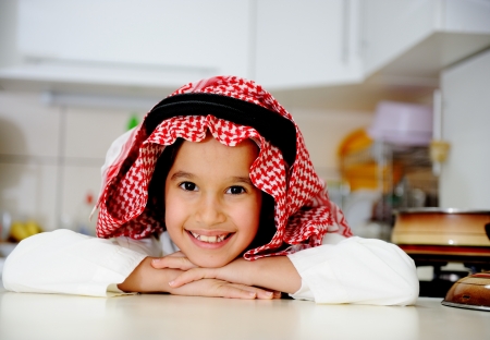 Little kid boy is cookingの写真素材