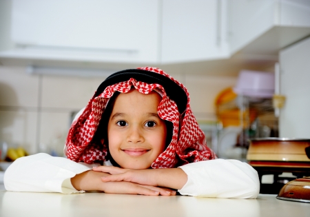 Little kid boy is cookingの写真素材