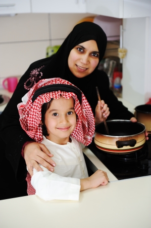 Portrait of young mother and her son having lunch togetherの写真素材