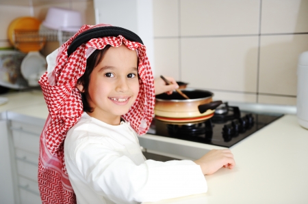 Little kid boy is cookingの写真素材