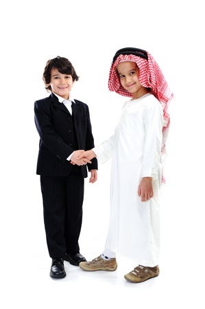 Arabic and caucasian little businessmen hand shakingの写真素材