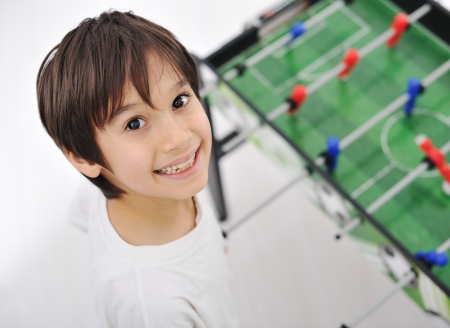 Children playing board soccerの写真素材