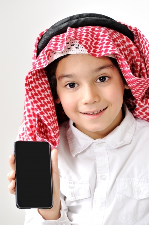 Cute Arabic Kid with cell phoneの写真素材