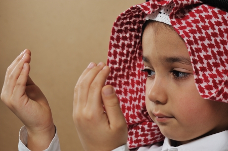 Muslim Arabic Kid prayingの写真素材