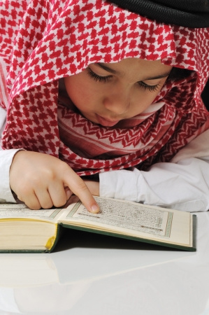 Muslim boy reading Koranの写真素材