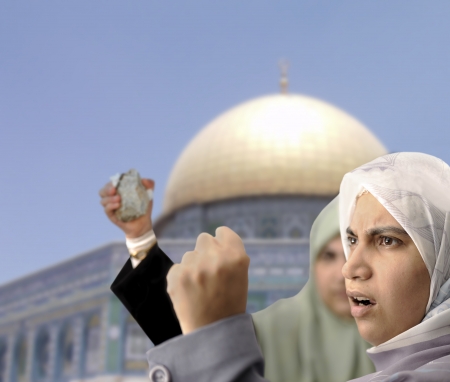 Angry Palestine women fighting with rocks in handsの写真素材