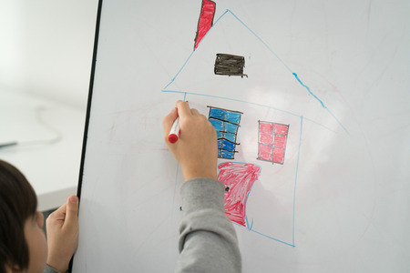 Messy child drawing and paintingの写真素材