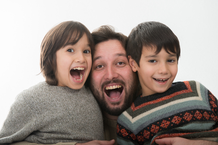 Happy Father with two sons Portraitの写真素材