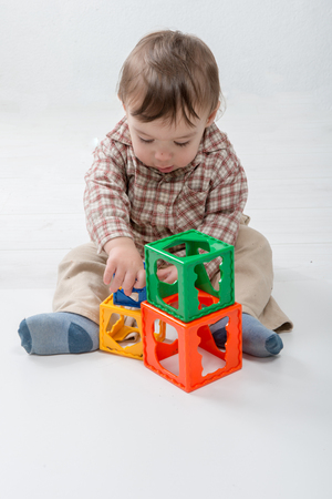 A Little Baby Playing with Toysの写真素材