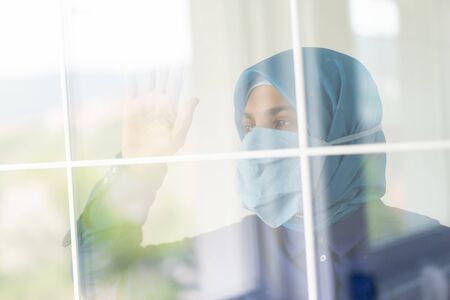 Muslim woman cannot wait to get out of homeの写真素材